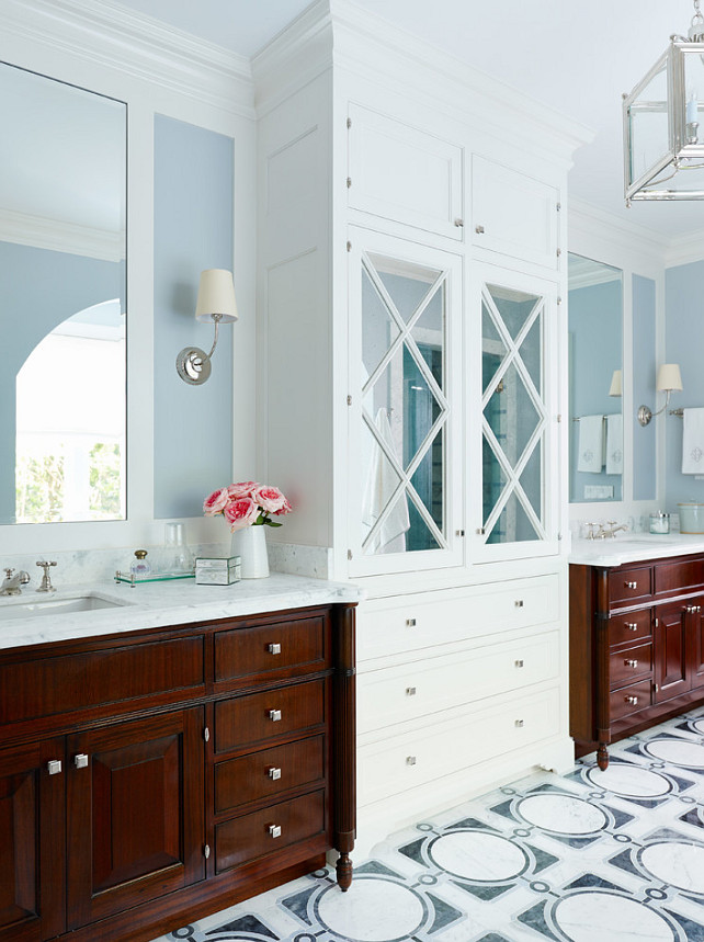 Bathroom. Blue Bathroom with white cabinet. Bathroom with blue walls and white cabinet. Bathroom sconces are the Vendome Single Sconce. #Bathroom #BlueBathroom #BathroomWhiteCabinet #VendomeSconce Andrew Howard Interior Design.