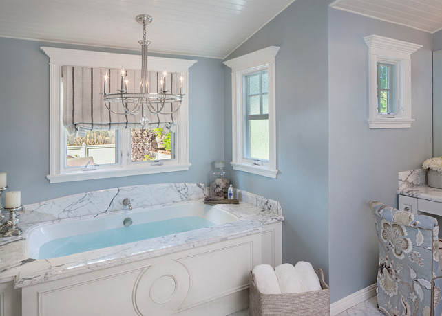 Bathroom. Elegant blue bathroom. Chandelier is from Currey & Company. Paint Color is Dunn-Edwards’ Alaskan Skies. #BathroomDesign #Bathroom