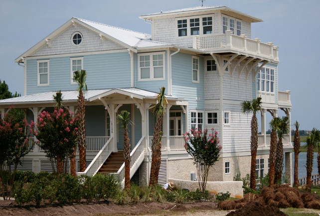 Turquoise Beach House. Beach House Exterior. Beach House Exterior Paint Color. Beach House Exterior Paint Color Ideas. Beach House Exterior Ideas. Beach House with key west, tongue & groove, brackets, oyster tabby, cool, widow's watch, palm tree, blue, cedar shingle, shake, metal roof. #BeachHouse #PaintColor Tongue & Groove Custom Builder.