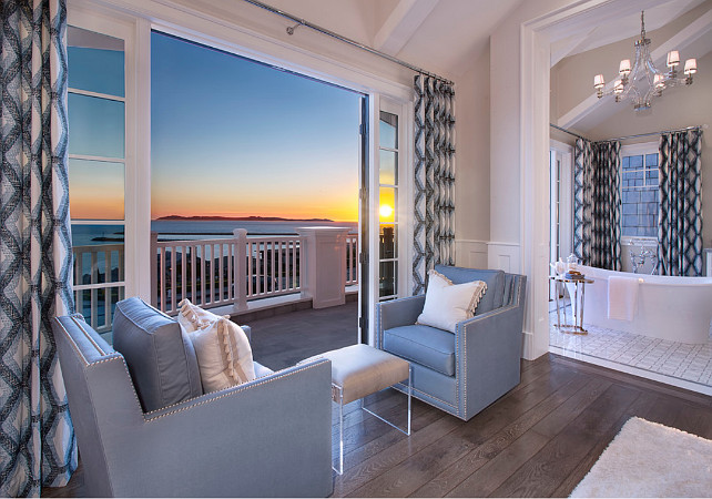 Bedroom Sitting Area. Bedroom Sitting Area with blue chairs, hardwood floors, ocean view, blue draperies. Bedroom sitting area opens to the master bathroom. #Bedroom #SittingArea Spinnaker Development.