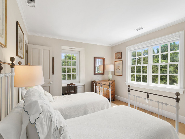 Bedroom. Cottage Bedroom with antique iron beds painted in white with crisp white bedspread. #Bedroom #GuestBedroom #CottageBedroom #WhiteBedspread