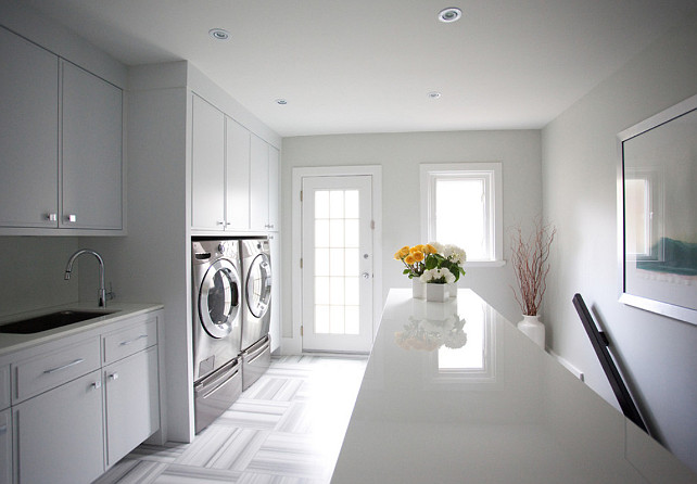 Laundry Room Design Ideas. How to get the look of this "laundry room": Benjamin Moore Moonshine OC-56 The countertop is a mini crystal slab (marble) in white. The floor is a equator marble honed in a basket weave pattern. #LaundryRoom 