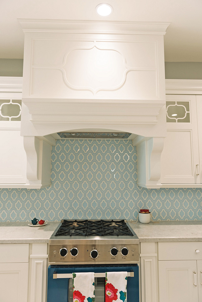 Blue Backsplash Tiles. White Kitchen with blue backsplash tiles and blue range. #Kitchen #BlueBacksplash #BlueTiles #BlueTiling Four Chairs Furniture.