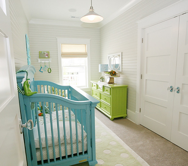 Nursery Decor Details. Cute nursery design with turquoise crib, polka dots rug, bright green dresser, white & green striped glider, beadboard walls, vintage glass door knobs, and linen romans shades. #Nursery