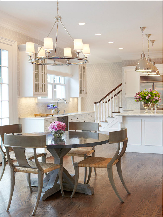 Breakfast Nook. This informal breakfast nook sits 4 to 6 and is composed of wood and rattan Klismos chairs, paired with a rough zinc top table. #Kitchen #BreakfastNook #EatingArea