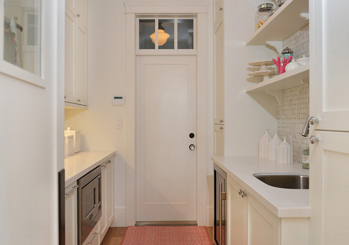 Butlers pantry with white cabinets and white quartz countertop. Door opens to dining room. #ButlerPantry #Pantry Sunshine Coast Home Design.