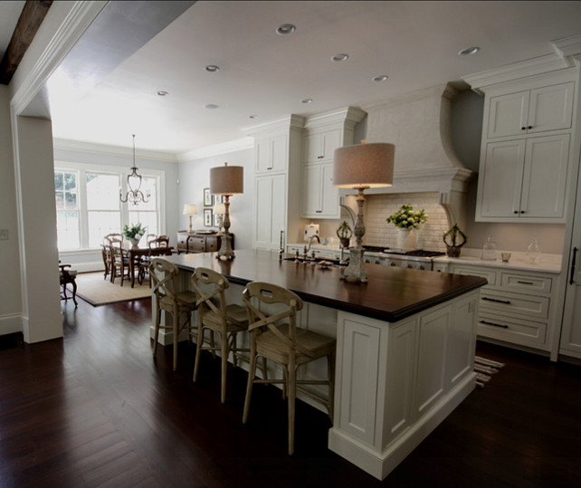 French Kitchen Design. This French kitchen was beautifully design. I love the white cabinets and the French Stone Hood. #FrenchKitchen #FrenchInteriors #Interiors