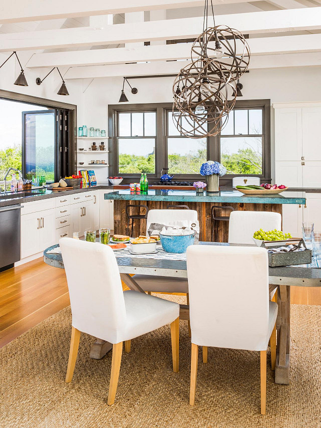 Coastal Kitchen. Coastal kitchen with Shaker cabinets, concrete counters, and an island clad in salvaged barn wood and topped with colored concrete. #CoastalKitchen #Coastal #Kitchen HGTV.