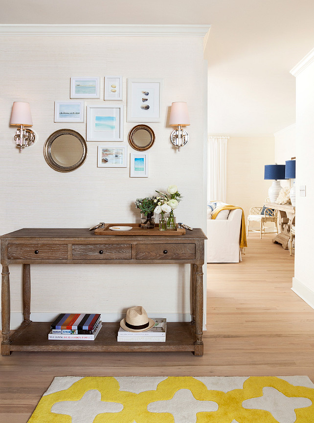 Coastal foyer with grasscloth wallpaper. Coastal foyer with grasscloth covered walls, coastal decor and bleached oak floors. #CoastalFoyer #Foyer #Coastal #CoastalInteriors #grasscloth Chango & Co.