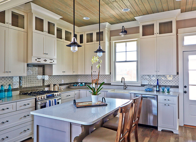 Cream white kitchen with quartz countertop, hardwood floors and beadboard ceiling. #CreamWhiteKitchen #Kitchen #Quartz #KitchenCounterop