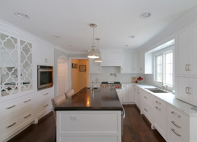 Crisp White Kitchen with Dark Stained Butcher Block Countertop. #CrispWhiteKitchen #DarkStainedButcherBlockCountertop #ButcherBlockCountertop Redstart Construction.