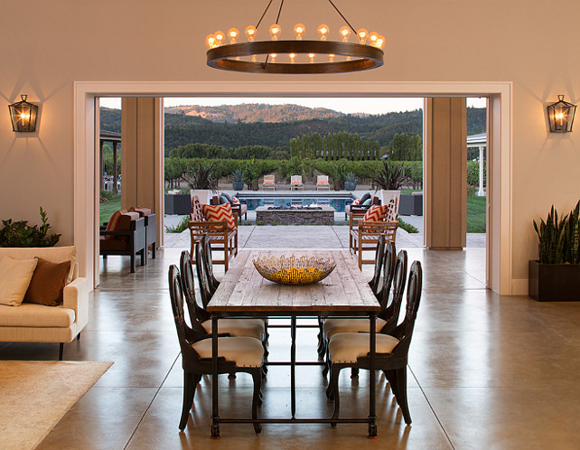 Dining Room Open Dining Room layout. Dining Room opens to patio. Chairs are from Noir Furniture. Dining Room Chandelier is from Restoration Hardware. #DiningRoom Artistic Designs for Living.