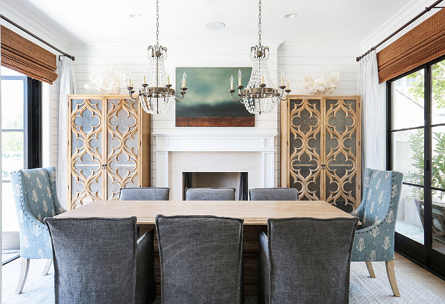 Dining Room. paris flea market chandeliers dining room paris flea market chandelier blond wood dining table charcoal gray dining chairs charcoal gray slipcovered dining chairs blue wingback dining chairs dining room fireplace quatrefoil cabinets quatrefoil glass cabinets tall dining room cabinets tall quatrefoil cabinets freestanding dining room cabinets shiplap dining room Blackband Design.