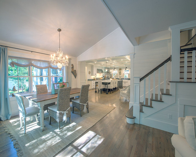 Dining Room. Casual coastal dining room with French chandelier, light hardwood floors, shiplap walls and woven chairs. #DiningRoom #CasualDiningRoom Sotheby's Homes