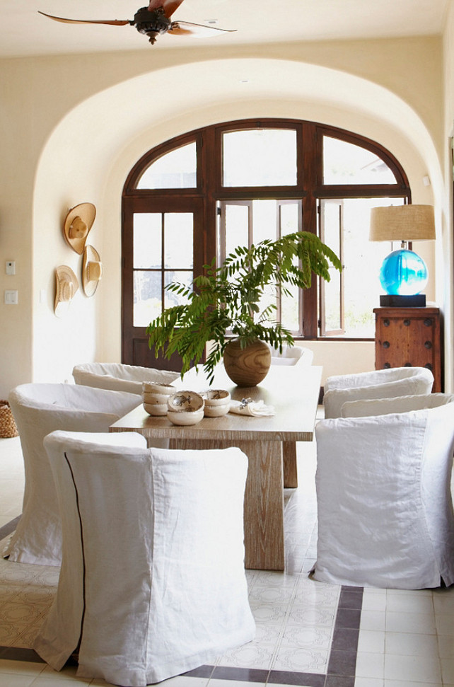 Dining Room. Mediterranean Dining Room with Slipcovered Chairs. Interior Design by Beth Webb Interiors.