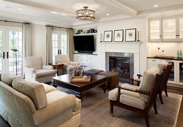 Family Room Furniture Ideas. Family room remodel featuring custom oak floors, a coffered ceiling, wet bar, and gas fireplace. #FamilyRoom 