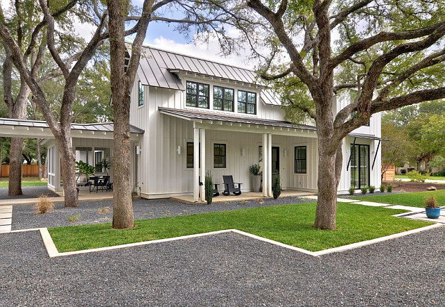 Farmhouse. Modern farmhouse with white plank exterior, front porch and gray metal roof. Black windows are by Marvin, and the color is Ebony. Redbud Custom Homes.