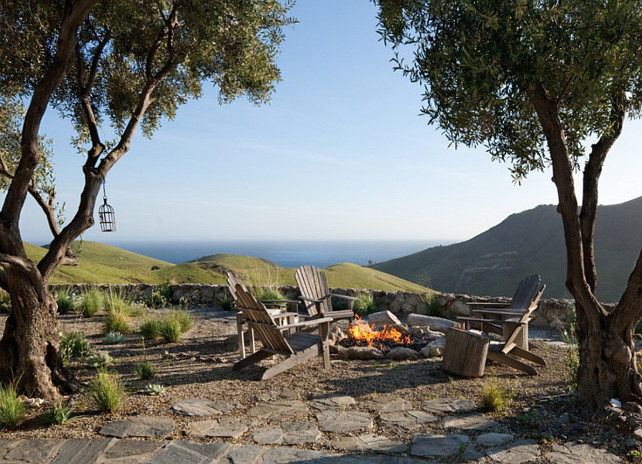 Fire pit. Fire pit Ideas. Backyard Fire pit. Naturalist Ocean View landscape Stone Fire Pit with adirondack chairs makes for a great outdoor living space. #Firepit Grace Design Associates.