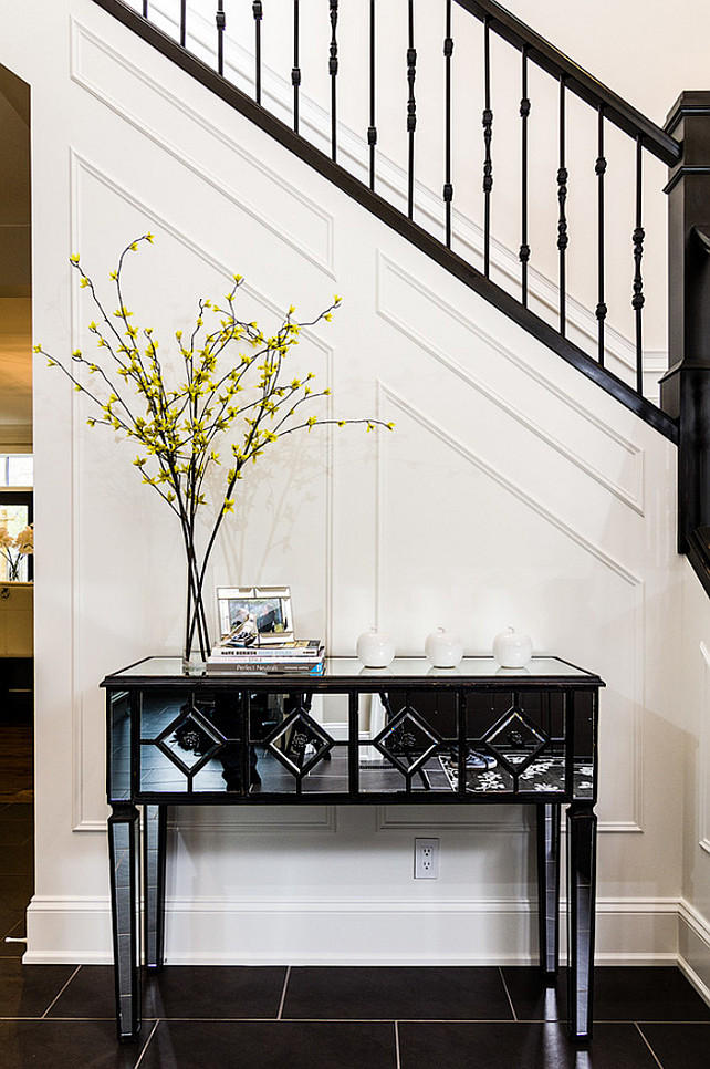 Foyer Decorating Ideas. Foyer with dark soapstone flooring and paneled walls.