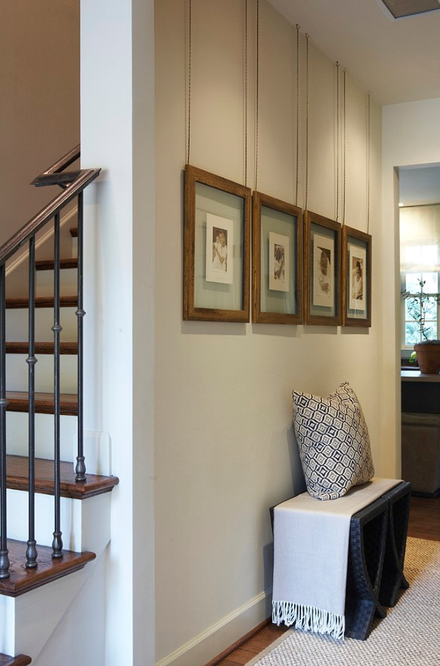 Foyer Picture Display ideas. Foyer Photo Gallery Display. The photos are custom framed (floating frames), and the painted chain came from a hardware store. Dana Wolter Interiors