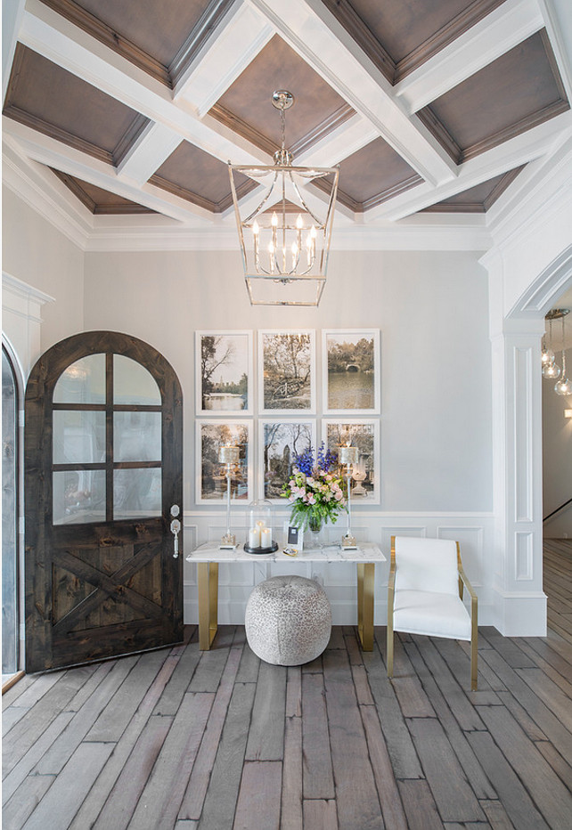 Foyer. Foyer entryway. Foyer with lantern pendant, plank hardwood floors, custom ceiling treatment and arched front door. #Foyer Joe Carrick Design.