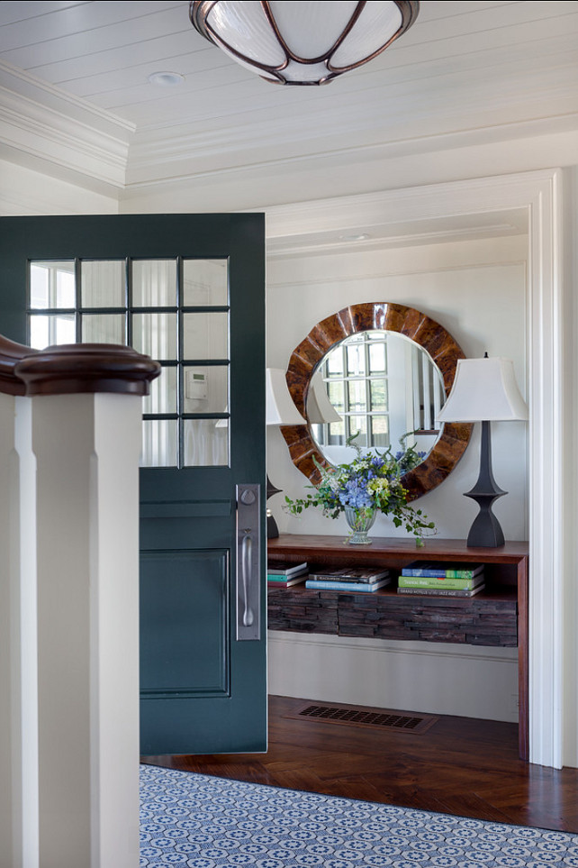 Foyer. Great foyer design. In this foyer, I really like the contrast of the front door paint color against the neutral walls and also the hardwood floors in herringbone pattern. Similar Front Door Paint Color: "Benjamin Moore Schooner AF-520". #BenjaminMoore #Schooner AF-520#Foyer