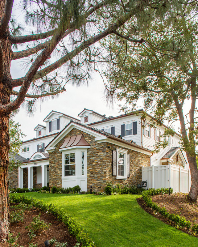 Front yard with mature trees and new landscaping. #landscaping #Gardens Legacy Custom Homes, Inc.