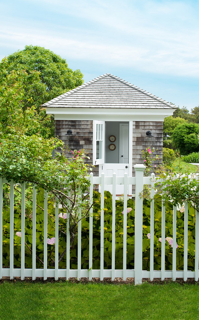 Garden Shed. Garden shed with barn sconces. Pyramid roof. Roses shed. Garden structure. White Dutch door