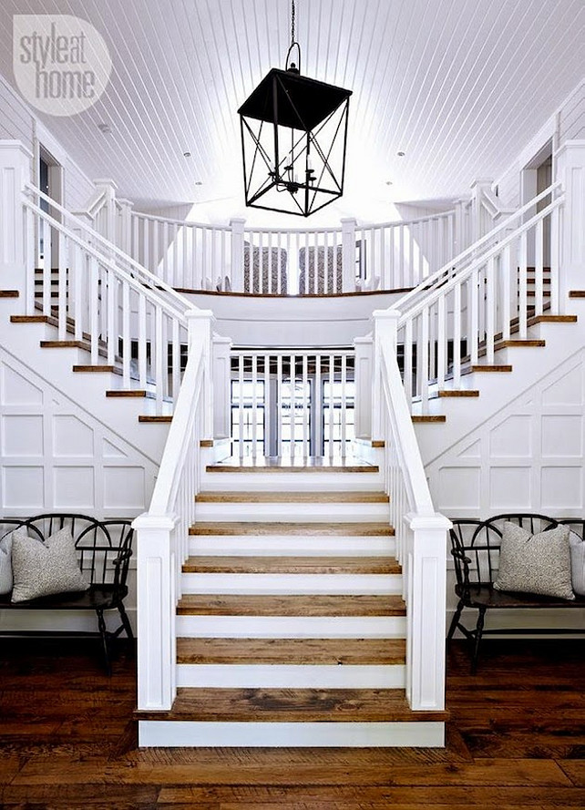 Grand Foyer Staircase. Coastal Foyer Staircase designed by Muskoka Living Interiors. #MuskokaLivingInteriors #Staircase #Foyer