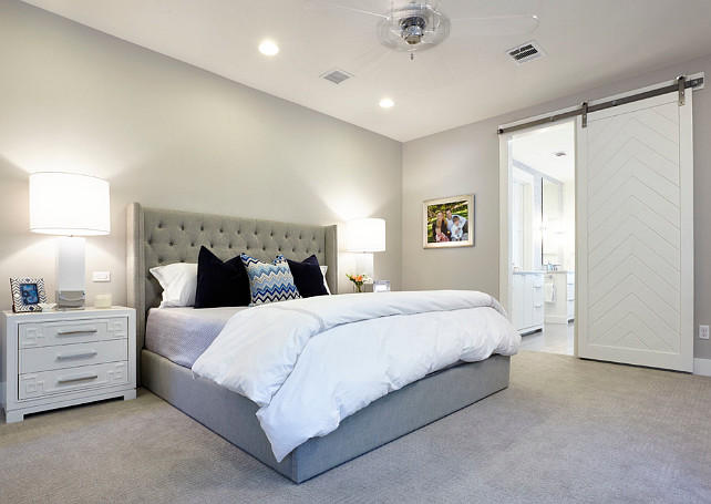 Gray Bathroom with white sliding barn door. Gray master bedroom. White sliding barn door. Butter Lutz Interiors, LLC.