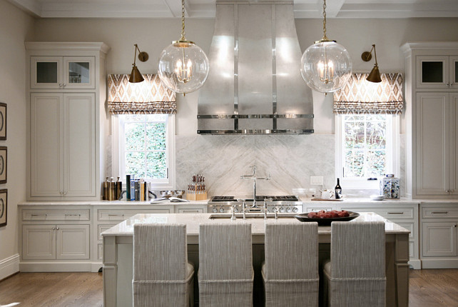 Gray Kitchen. Pale Gray Kitchen. Gray Kitchen Cabinet with custom hood. #Kitchen #GrayKitchen #GrayKitchenPaintColor #PaleGrayKitchen Barbara Brown Photography. Bell Kitchen and Bath Studios.