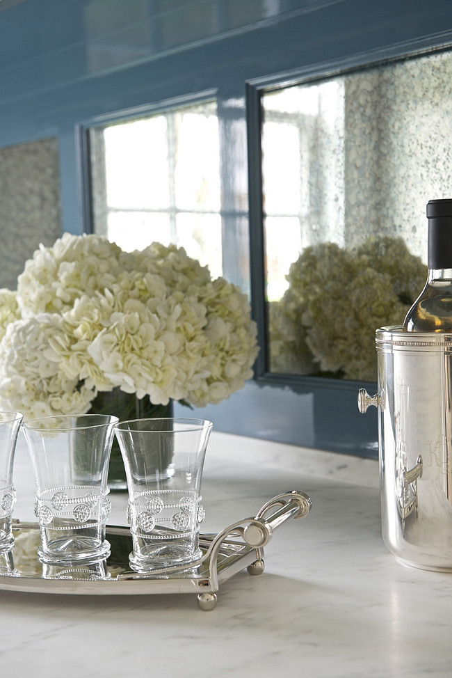 High gloss blue cabinets paired with white marble countertops. Kerry Hanson Design.