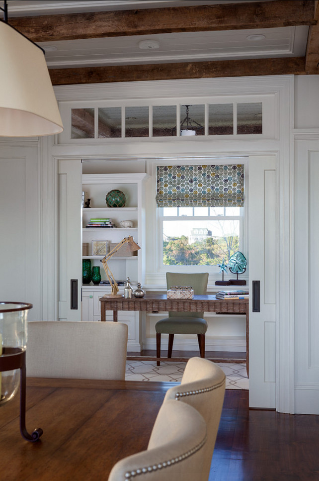 Home Office. Gorgeous home office with coastal decor. Double pocket doors with transom separates the dining room from a stylish home office. #HomeOffice #CoastalDecor