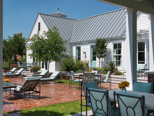 Home with metal roof and brick patio. #Home #HomeIdeas #MetalRoof #brick #Patio #BrickPatio M. Barnes & Co.