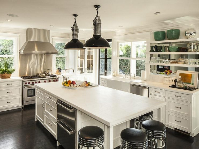 Industrial Kitchen. Industrial Kitchen Ideas. Industrial Kitchen Design. Kitchen with glossy black industrial pendants hanging over kitchen island with dishwasher drawers and honed white marble. #Kitchen #IndustrialKitchen