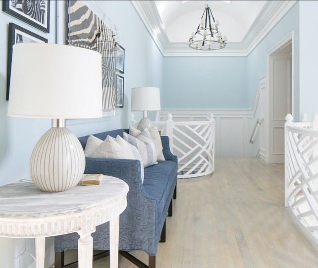 Interior Design Ideas. Upstairs landing. Custom staircase railings and wood paneling add character to the landing area. Chandelier is the "Ralph Lauren Westbury Double Tier Chandelier".