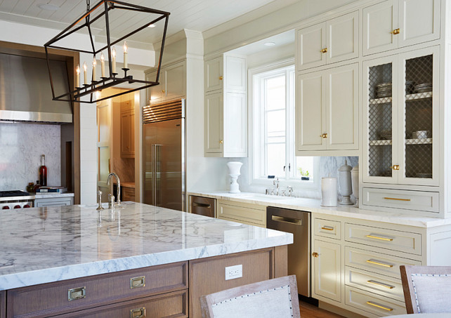 Ivory Kitchen Cabinet. Ivory Kitchen Cabinet Paint Color. The lighting in the kitchen is a E.F. Chapman Darlana Linear Pendant. #IvoryKitchen #PaintColor