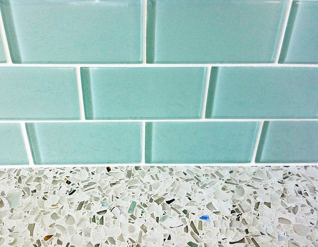 Kitchen Backsplash and Countertop. Kitchen Countertop and backsplash combination. The blue glass tiles are from "Contempo Tile". Turquoise glass subway tile backsplash with recycled glass countertops in kitchen.