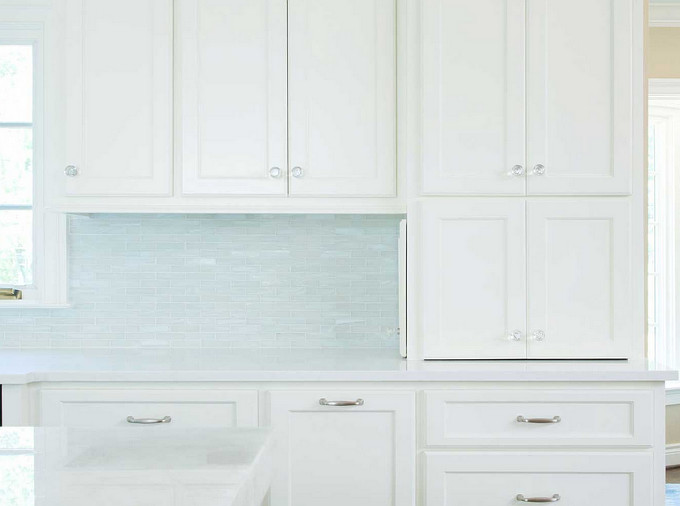 Kitchen Backsplash and glass knobs. Light turquoise backsplash tiles in white kitchen. Profile Cabinet.