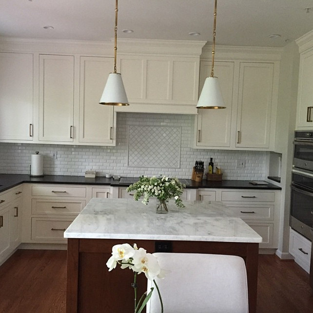 Kitchen Backsplash. Backsplash is Thasos marble 2x4 beveled and above cooktop is Thasos marble in an arabesque design. #Kitchen #Backsplash #KitchenBacksplash #ArabesqueBacksplash #ThasosMarble #ThasosMarbleBacksplash Kate Abt Design.