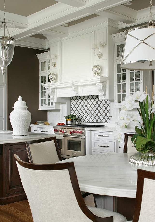 Kitchen Hood. Kitchen Backsplash. Kitchen with custom Hood. The backsplash is "MOS" pattern "Manilla" in marble. The mosaic rug above the stove is "Calacatta Oro", timber grey & lagos blue. Tile by Stratta Tile in Wyckoff, NJ. #Kitchen #Hood #KitchenHood #KitchenBacksplash