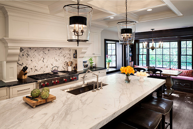 Kitchen Ideas. Kitchen Design. Kitchen Design Ideas. Kitchen features ample custom storage, a built-in banquette, and a large kitchen island to accommodate entertaining. These pendants are by Vaughan Designs (Zurich Lantern). #Kitchen 