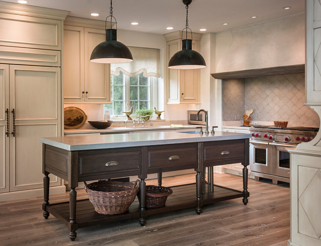 Kitchen Island. One of a kind island in fumed oak. Plumbing supply and waste pipes are sleeved with bronze pipes to match Rocky Mountain faucet finish. Hammered Zinc counter top and sink. #KitchenIsland