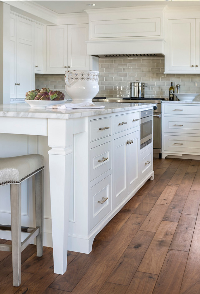 Kitchen Island. Kitchen Island Ideas. Kitchen island design. Custom kitchen island legs. Kitchen island painted Benjamin Moore Simply White accented with brushed nickel pulls along with calcutta marble counters
