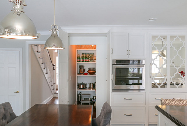 Kitchen Pantry Cabinet. Kitchen cabinet doors open to a hidden walk-in pantry. #Kitchen #Pantry #PantryCabinet #HiddenPantry #KitchenPantry Redstart Construction.