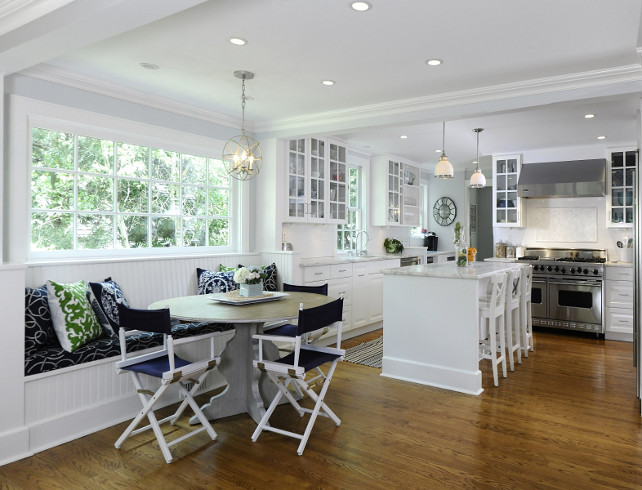 Kitchen and Breakfast nook with bench. White kitchen. Kitchen banquette. Kitchen nook bench. #Kitchen #KitchenNook #NookBench #NookBanquette Via Sotheby's Homes.
