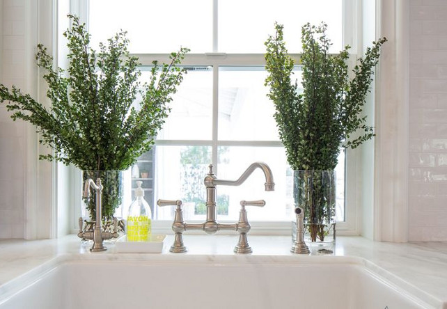 Kitchen faucet with apron sink. Farmhouse sink with satin nickel gooseneck faucet is always a classic choice for any white kitchen. #apronsink #kitchen #Faucet Kelly Nutt Design.