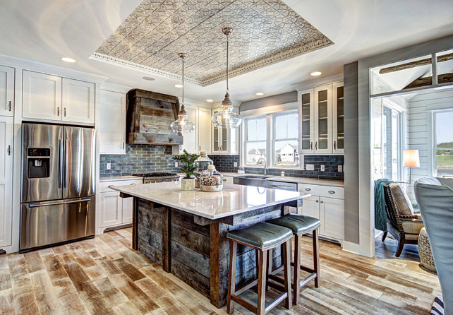 Kitchen with barn wood island. #Kitchen Barn Wood Kitchen island #BarnWood #BarnWoodKitchenIsland Dwellings Inc.