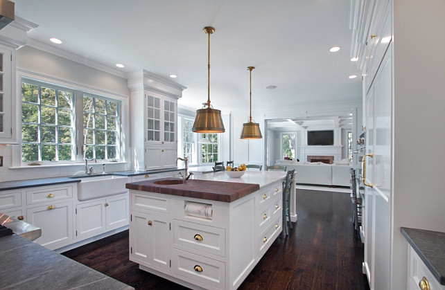 Kitchen with with antique brass hardware and Visual Comfort Lighting Single Sloane Street Shop Lights with Metal Shades in Antique Brass. #AntiqueBrass #Hardware #Lighting Blue Water Home Builders.