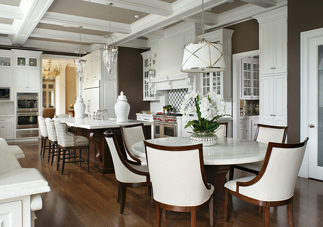 Kitchen. Kitchen with white cabinets, Honed Danby Marble countertop and hardwood floors. #Kitchen #WhiteKitchen